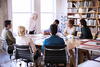 a group of individuals sitting at a table